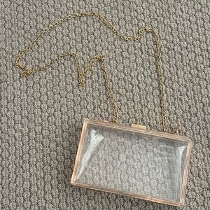 Transparent handbag with gold accents